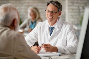 doctor-consulting-a-mature-man-as-for-the-therapy