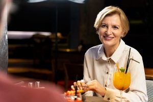 senior-womanwin-cocktail-in-a-restaurant